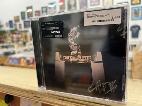 Don Toliver "Octane" CD with a cover featuring a person and the signature "Caleb", held in a clear plastic sleeve.