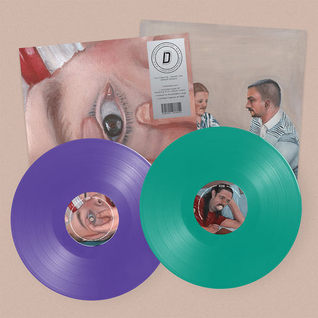 Two vinyl records in purple and mint green with printed album art, displayed in front of the alternate cover album art for Dry Cleaning "Secret Love" on a plain beige background.