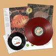 Pixies "Bossanova" album cover with white obi strip and a gold foil sticker. Shown with a red vinyl record and a black 7" record laid over top of the sleeves.