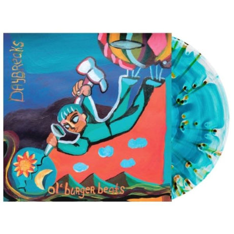 Ol' Burger Beat "Daybreaks" album cover shown with a sea blue with black and green splatter colored vinyl record