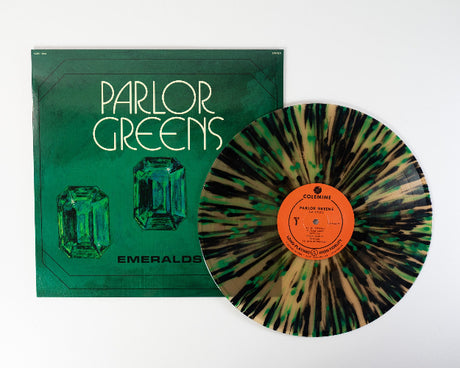 Parlor Greens 'Emerald' album cover featuring an emerald design, shown with a beer colored vinyl record with green and black splatter accents.