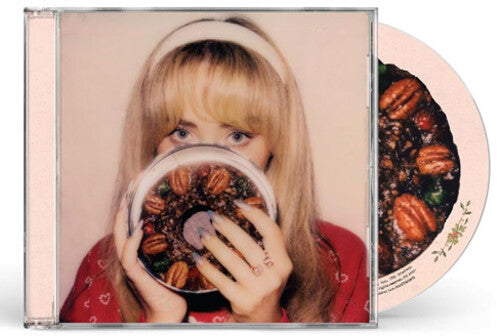 Sabrina Carpenter "Fruitcake" album cover shown with a CD with the image of a fruitcake on it