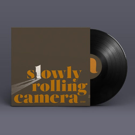 Slowly Rolling Camera "Silver Shadow" album cover shown with black vinyl record