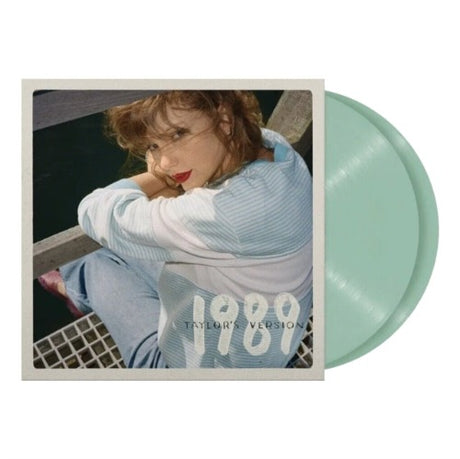 Taylor Swift - 1989 Taylor's version album cover shown with 2 Aquamarine Green colored Vinyl records