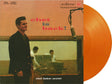 Chet Baker - Chet Is Back! album cover and orange vinyl. 