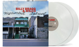 Album cover showing line of 2-story brick homes along a street with 'Billy Bragg & Wilco' written in the sky in red text and "mermaid avenue' black text underneath, with two white vinyl records sticking out of the sleeve.