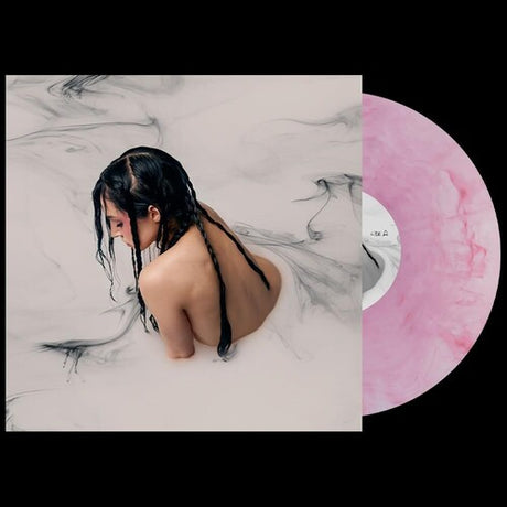 Poppy - Negative Spaces album cover and pink vinyl. 