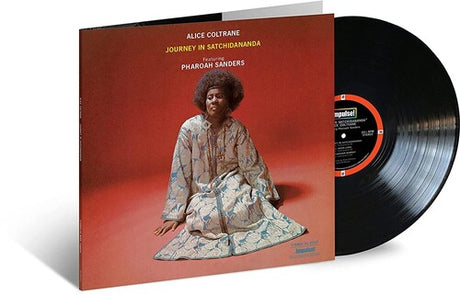 Alice Coltrane - Journey in Satchidananda album cover shown with black vinyl record