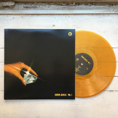 Crown Jewels Volume 1 album cover with gold colored vinyl record