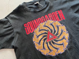 Soundgarden Badmotorfinger Vintage 1990's Promotional Black T-Shirt - Close up view of front of Red soundgarden text, gold spiral, and red badmotorfinger text in triangle