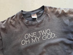 Vintage Beastie Boys Faded Black T-Shirt "One Two, Oh My God." Front Close Up including image of Oneita tag