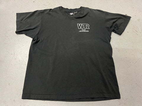 Rap Declares War Vintage Shirt - photo of front side with pocket print stating "WAR is back...and in the house" Black shirt with white text