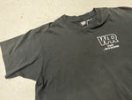Rap Declares War Vintage Shirt - close up photo of front side with pocket print stating "WAR is back...and in the house" Black shirt with white text