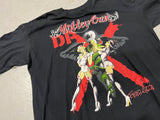 Vintage Motley Crue Dr. Feel Good Tour Shirt - Close up photo of front of shirt showing two nurses on a snake wrapped blade with "Motley Crue" text above image and Dr X behind image