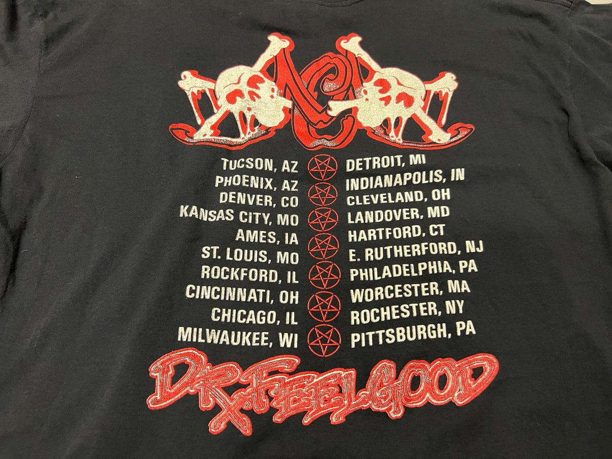 Vintage Motley Crue Dr. Feel Good Tour Shirt - Close up photo of backside of shirt showing Dr. Feelgood Tour tades and two skull and crossbones