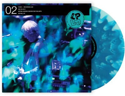 Phish L P on L P 01 album cover with blue wave vinyl record