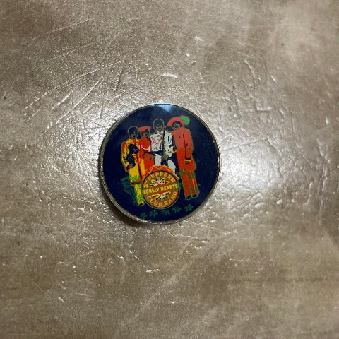 Sgt. Pepper's Beatles pin - front image of band against black backdrop