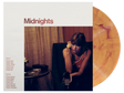 Taylor Swift - Midnights Blood Moon Edition album cover with yellowish-red marble vinyl record