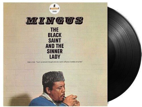 Charles Mingus - The Black Saint and the Sinner Lady album cover and black vinyl.